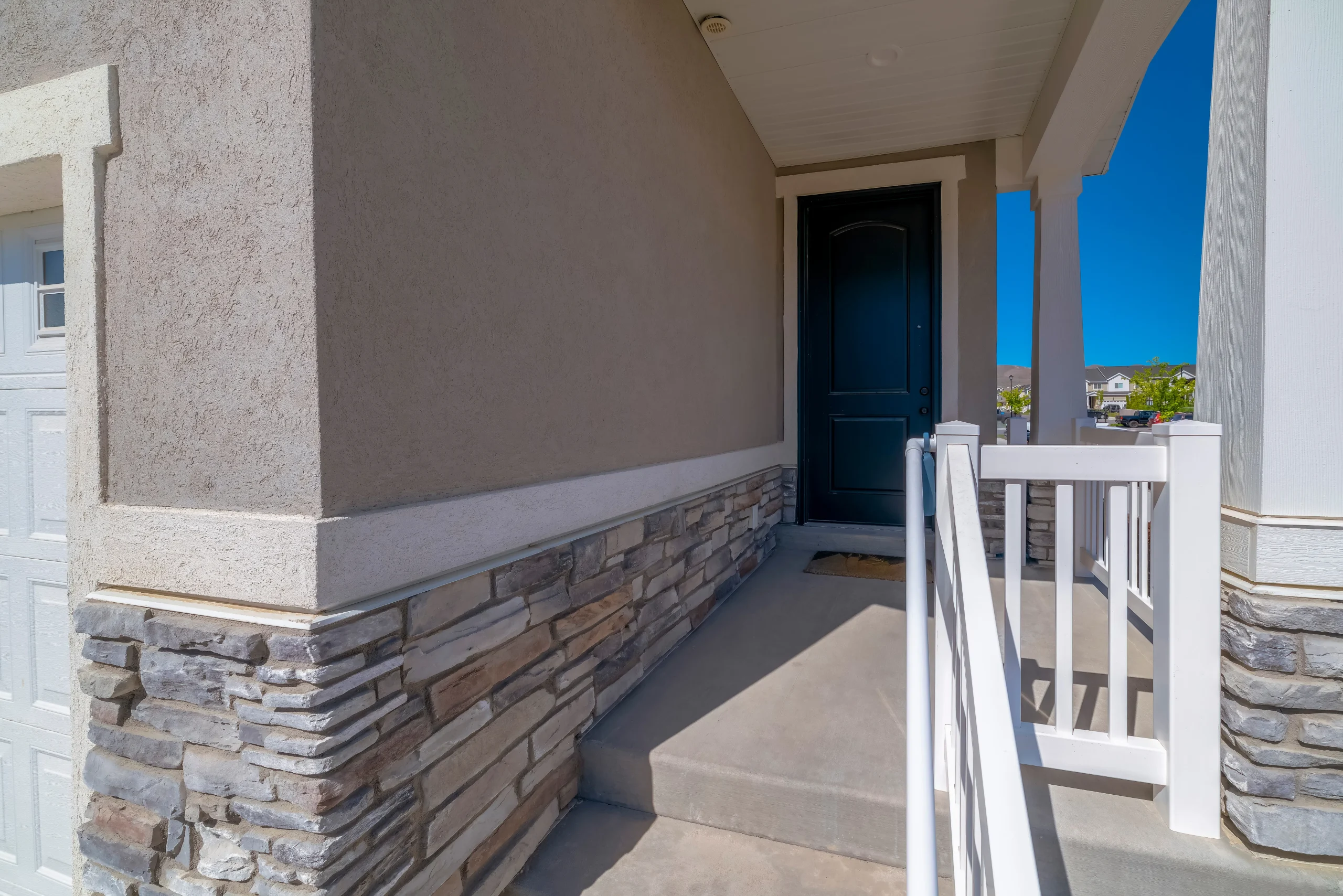Traditional home featuring rustic grey fieldstone siding and mortar joints.